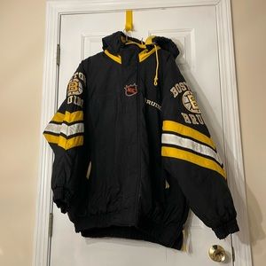 Vintage 90s NHL Boston Bruins Center Ice Collection Starter puffer jacket.